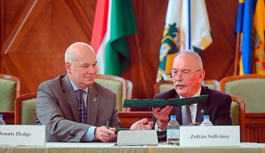 SDSU Provost and Vice President for Academic Affairs Dennis Hedge exchanges documents with University of Debrecen Rector Zoltán Szilvássy as part of an academic cooperation agreement signing last month in Hungary.