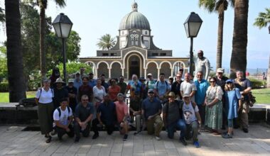 The veteran contingent gathers in front of the Church of the Beatitudes.