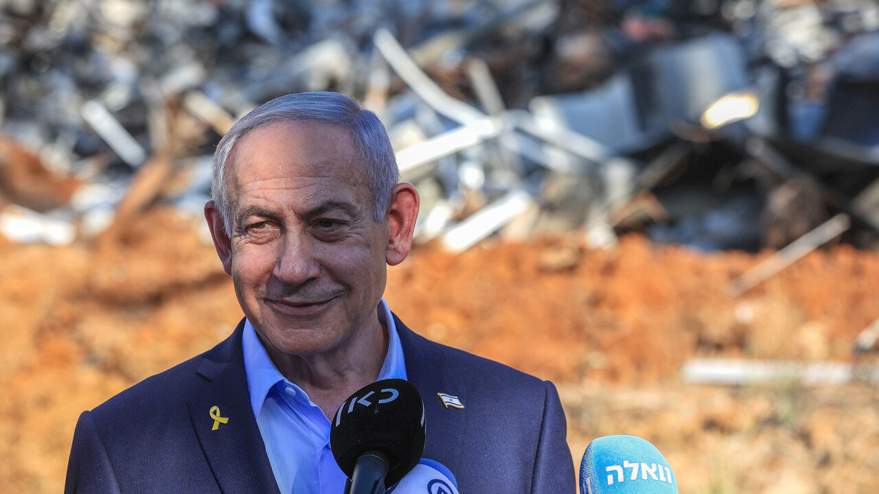 Israeli Prime Minister Benjamin Netanyahu smiles.
