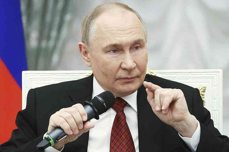 Russian President Vladimir Putin speaks with participants of the Time of Heroes, an educational program for veterans of special military operation, at the Kremlin in Moscow, Russia, Thursday, June 12, 2025. (Sergei Bulkin, Sputnik, Kremlin Pool Photo via AP)