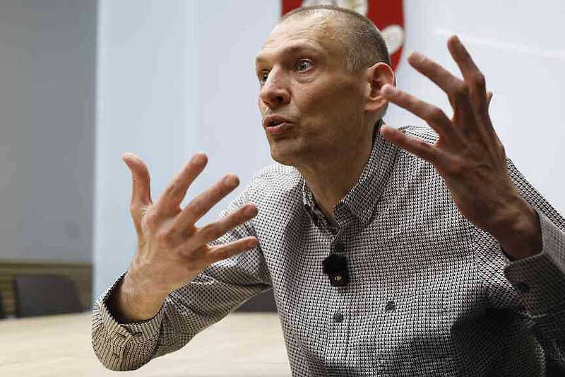 Syarhei Tsikhanouski, a Belarusian opposition activist released from a prison by Belarusian authorities, gestures during an interview with the Associated Press in Vilnius, Lithuania, Sunday, June 22, 2025. (AP Photo/Mindaugas Kulbis)