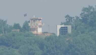 A North Korean military guard post, left, and loudspeaker are seen from Paju, South Korea, near the border with North Korea, on June 12.