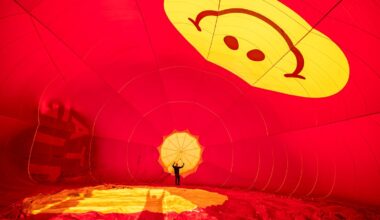 A pilot checks his balloon at dawn — and other news in pictures