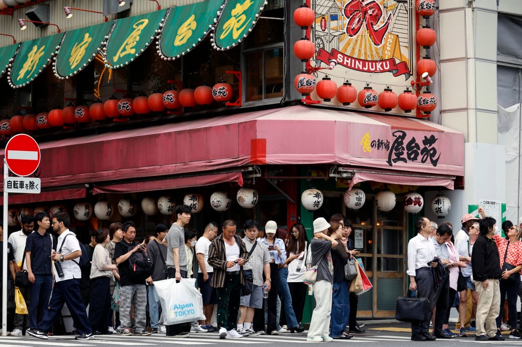 People cross a street in Tokyo’s Shinjuku business and shopping district. Japan’s economy recorded its first economic contraction in four quarters. Photo: EPA-EFE People cross a street in Tokyo’s Shinjuku business and shopping district. Japan’s economy recorded its first economic contraction in four quarters. Photo: EPA-EFE