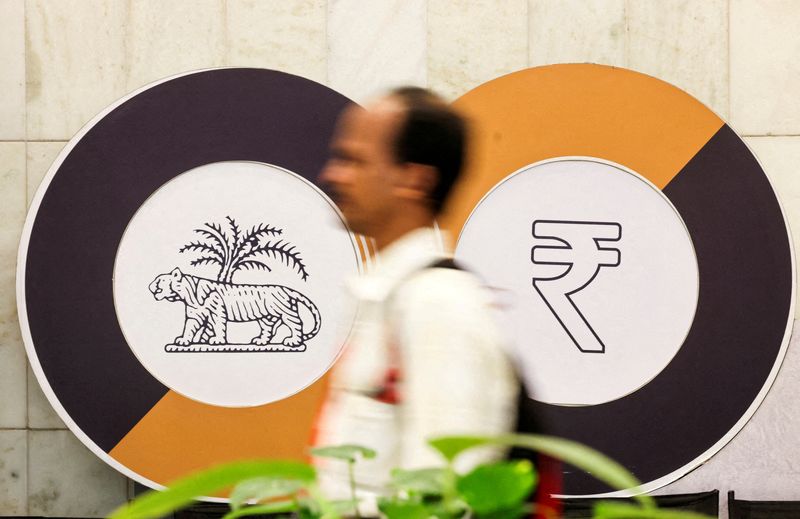 India central bank steps in to contain fallout of oil price jump on rupee, traders say