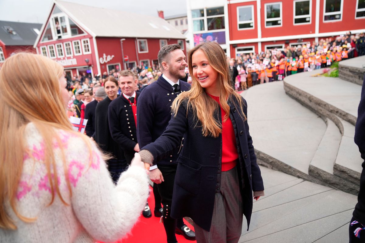 Denmark's Princess Josephine greets well-wishers as she attends an official reception with Queen Mary and King Frederik X at the city's steps in Vagsbot in Torshavn on the Faroe Islands 