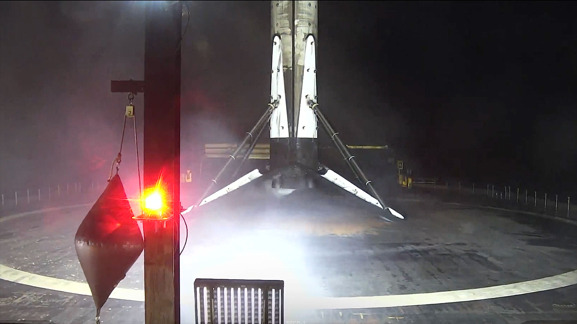 the first stage of a rocket stands on an ocean-based platform following a launch into space