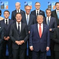 (Front from L) Finland's President Alexander Stubb, Netherlands' Prime Minister Dick Schoof, France's President Emmanuel Macron, NATO Secretary General Mark Rutte, US President Donald Trump, Greece's Prime Minister Kyriakos Mitsotakis, Britain's Prime Minister Keir Starmer, Hungary's Prime Minister Viktor Orban stand with NATO country leaders for a family photo during the North Atlantic Treaty Organization (NATO) Heads of State and Government summit in The Hague, on June 25, 2025. NATO leaders hold a two-day summit on June 24 and 25 in The Hague. (Photo by NICOLAS TUCAT / AFP)