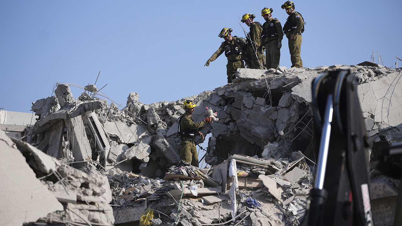 Iranian missile strikes in Israel kill at least 6; defense minister warns 'Tehran will burn'