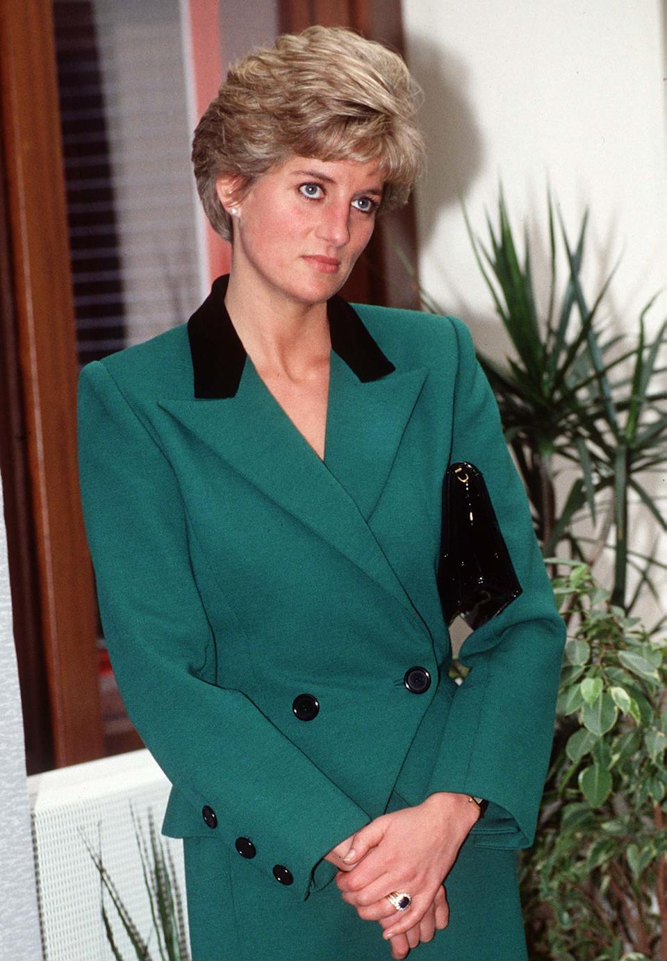 Princess Diana wearing a green suit