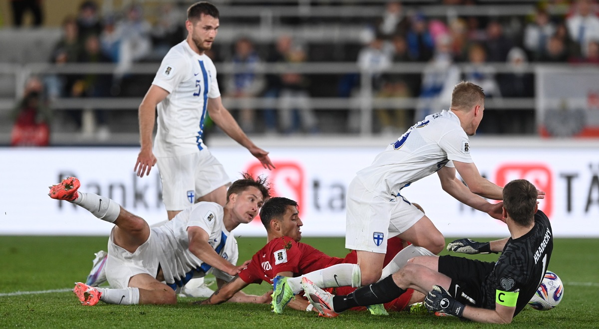 Jakub Kiwior (centre) scores for Poland in Helsinki on Tuesday night.