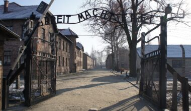 Entrance to the former Auschwitz death camp with the infamous Arbeit Macht Frei (Work Sets You Free) sign.