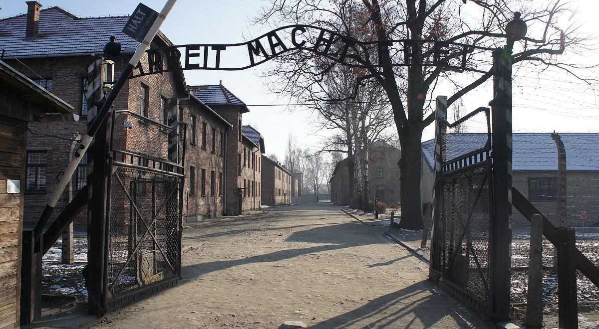 Entrance to the former Auschwitz death camp with the infamous Arbeit Macht Frei (Work Sets You Free) sign.