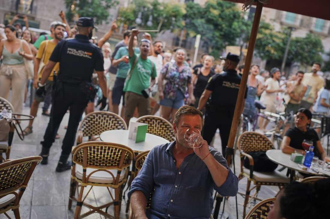A tourist during an anti-tourist protest in Barcelona yesterday