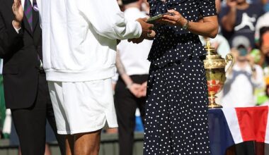 Kate Middleton is pictured presenting Nick Kyrgios with the runner-up's trophy after the 2022 Wimbledon men's singles final