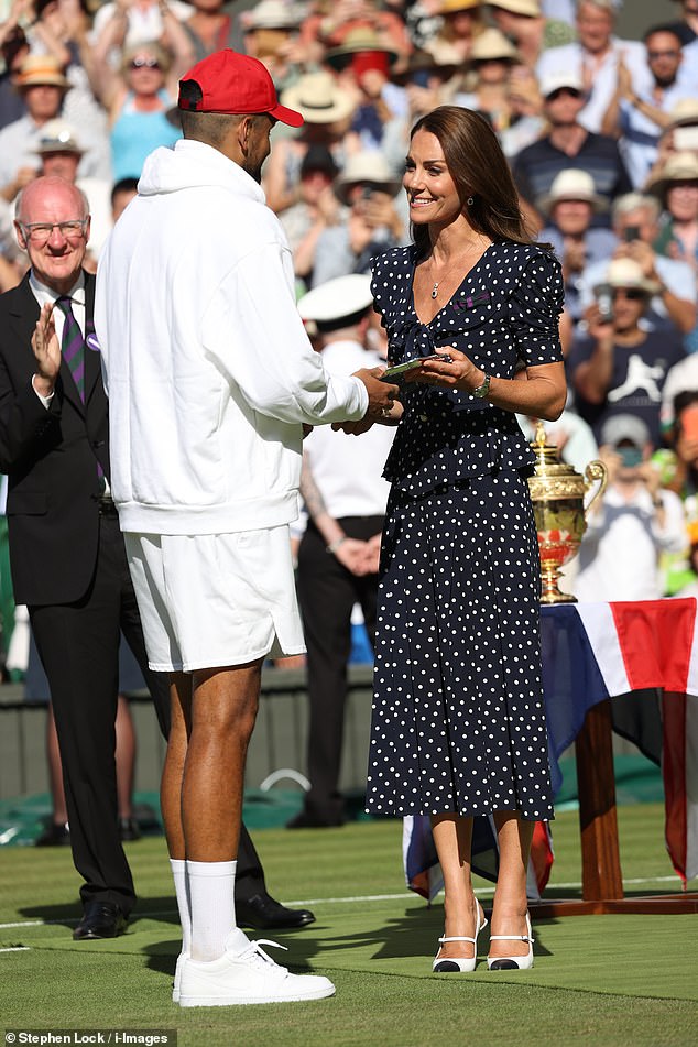 Kate Middleton is pictured presenting Nick Kyrgios with the runner-up's trophy after the 2022 Wimbledon men's singles final