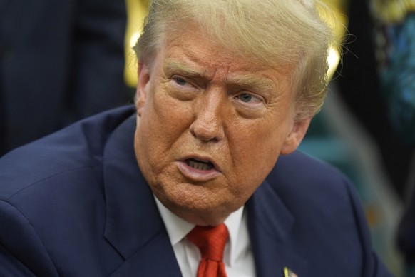 President Donald Trump answers questions from reporters as he meets with Congo's Foreign Minister Therese Kayikwamba Wagner, and Rwanda's Foreign Minister Olivier Nduhungirehe, Friday, June ...