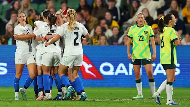 Slovenia's Mirjam Kastelec celebrates with teammates after scoring the equaliser against the Matildas. 
