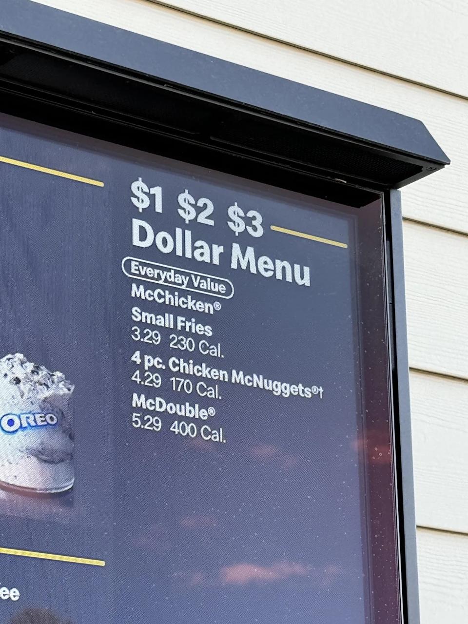 McDonald's Dollar menu board with items priced at $3.29, $4.29, and $5.29