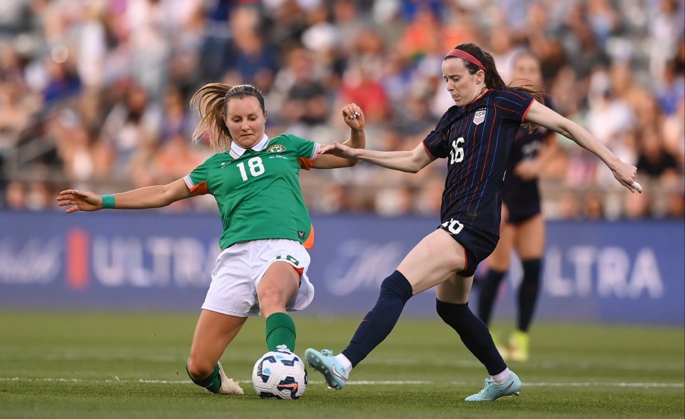26 June 2025; Rose Lavelle of United States is tackled by Kyra Carusa of Republic of Ireland during the women's international friendly match between the USA and Republic of Ireland at Dicks Sporting Goods Park in Commerce City, Colorado, USA. Photo by Stephen McCarthy/Sportsfile