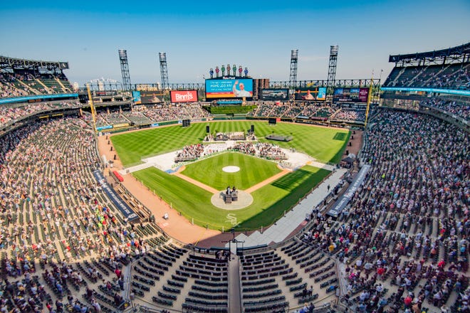 Churchgoers attend the Archdiocese of ChicagoÕs Catholic mass hosted at Rate Field, home of the Chicago White Sox.