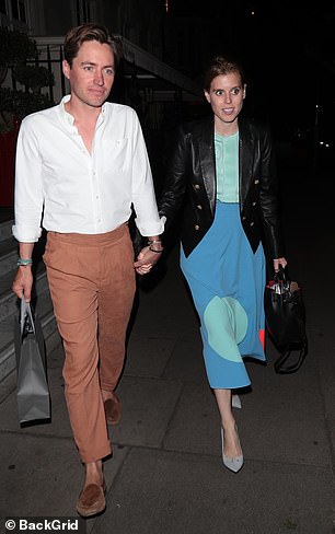 She added a seafoam green satin blouse
