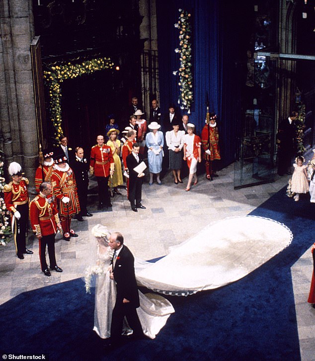 The bride's train was 17ft and 6 inches long and was designed by Lindka Cierach