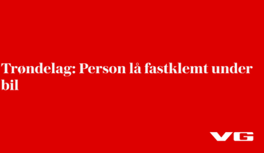 Person lå fastklemt under bil