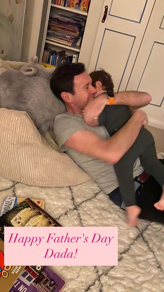 Jack Brooksbank hugging his son Ernest on a beanbag next to books