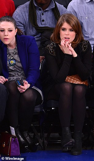 Sitting side-by-side, Eugenie and Michelle appeared deep in concentration as they watched the basketball game with one another
