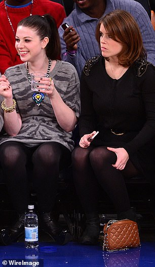Sitting side-by-side, Eugenie and Michelle appeared deep in concentration as they watched the basketball game with one another