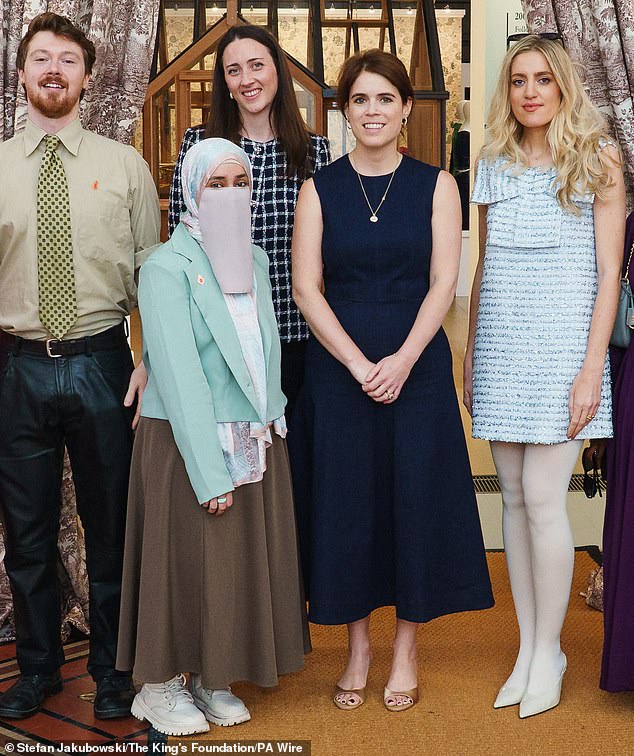 The late Queen's granddaughter wore a deep navy blue canvas dress paired with delicate kitten heels and a simple gold pendant necklace