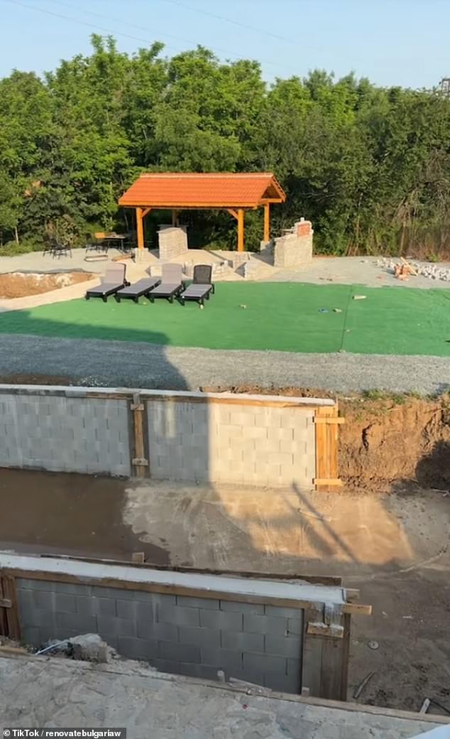 Their £25,000 pad came with outbuildings and half an acre of land. Pictured: The turf and the bar area