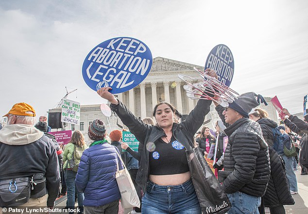 A pro-choice protester at a rally outside the US Supreme Court in March 2024