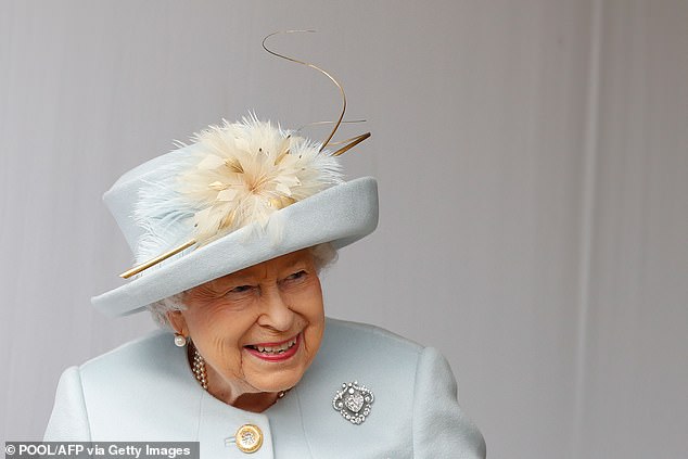 Royal protocol dictates that no one is allowed to sit in front of the Queen and obstruct her view