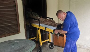 The facilities, in the village of Yagoda, near city Stara Zagora, were run as so-called health centres for the elderly, offering 'rooms for rent' for around 400 Euros per month. Pictured: An elderly person transported out of the facilities by a healthcare worker