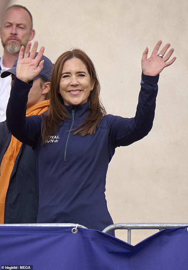 Showing her support, mother-of-four Mary greeted her loved ones as she donned a matching blue zip-up commemorating the occasion - which is being marketed as the 'world's largest royal amateur sporting event'
