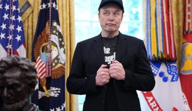 Tesla CEO Elon Musk listens as U.S. President Donald Trump speaks to reporters in the Oval Office