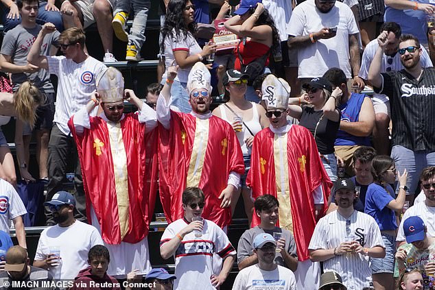 Chicago White Sox fans dressed like Pope Leo XIV in the bleachers during a game between the Chicago Cubs and the Chicago White Sox at Wrigley Field on May 16