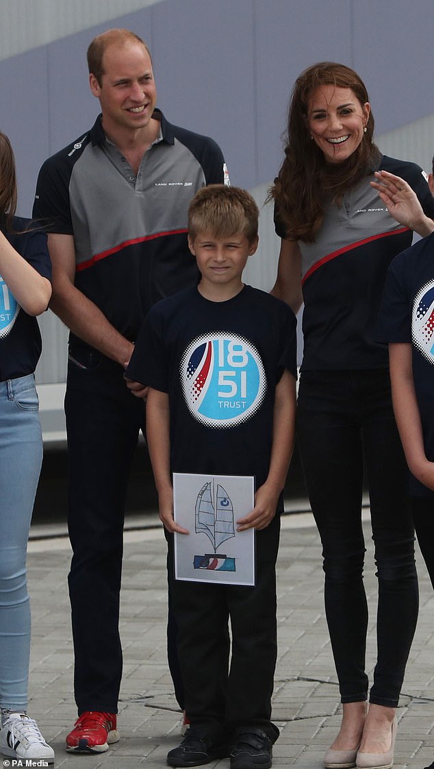 Zak Kay with his winning design between the then Duke and Duchess of Cambridge at the Land Rover BAR team base during a visit to Portsmouth to see the America´s Cup World Series (PA) in 2016