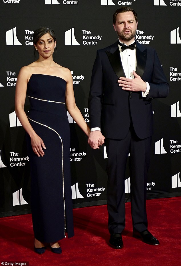 Vice President JD Vance also wore a tuxedo but in a navy blue. As for his wife, Usha Vance, she opted for a $635 Shoshanna strapless dark blue gown that contained a white stripe that went around her midriff area and down the skirt. Toned-down yet stylish, the two's coordinating colors complimented one another