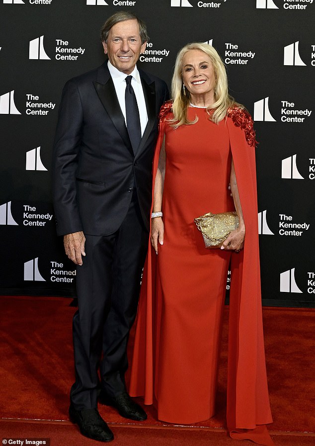 Fashion designer Pamella Roland DeVos and her businessman husband Daniel DeVos were also in attendance. She donned a fiery red gown that contained dramatic shoulder embellishments and had long pieces of fabric that hung to the ground. Daniel, on the other hand, kept it simple in a black suit