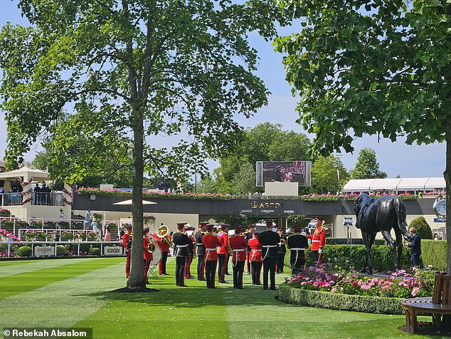 The regimental march of the Band of the Coldstream Guards entertain attendees in the Parade Ring