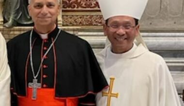 Bishop Michael Pham (right) of the Diocese of San Diego poses for a photo with then Cardinal  Robert Francis Prevost before he became Pope Leo. The pontiff elevated Pham to the position of bishop in June
