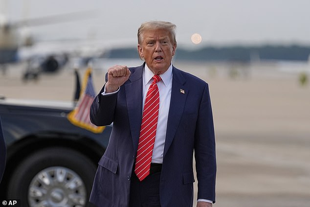 President Donald Trump gestures after arriving on Air Force One on Wednesday night after arriving back in Washington, D.C. after attending the NATO Summit in the Hague, Netherlands