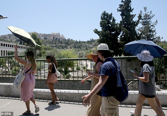 GREECE: Tourists walk through Thissio neighbourhood amid a heatwave in Athens, Greece, 27 June