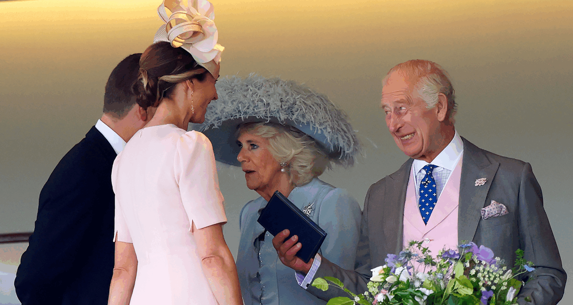 King Charles laughing talking to Harriet Sperling and Peter Phillips