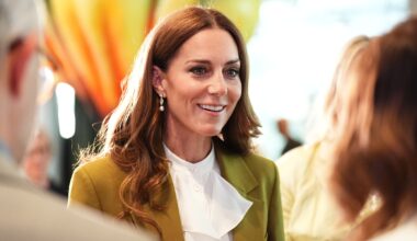 Catherine, Princess of Wales smiles, wearing an olive green suit, at the British Fashion Council at 180 Studios in central London