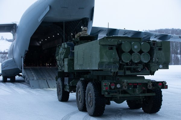 U.S. Army Staff Sgt. Russell Jaso, assigned to 3rd Battalion, 321st Field Artillery Regiment, helps position a High Mobility Artillery Rocket System inside a Belgian Air Force Airbus A400M Atlas during a High Mobility Artillery Rocket System Rapid Infiltration mission at Bardufoss Airport, Norway, March 27, 2025. The HIRAIN mission demonstrates NATO forces' capability to rapidly and jointly deploy the High Mobility Artillery Rocket System worldwide, enabling long-range precision fires to achieve maximum impact on the battlefield. The operation saw U.S., Norwegian, and Belgian forces working together to transport HIMARS from Ramstein Air Base, Germany, to Norway, culminating in fully integrated fire missions. (U.S. Army photo by Pfc. Brent Lee)