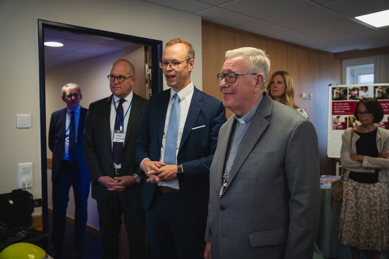Cardinal Jean-Claude Hollerich, Archbishop of Luxembourg (front right), tours the first meetinghouse in Luxembourg owned by The Church of Jesus Christ of Latter-day Saints, with Elder James W. McConkie III (left) and Nancy France Stake President Michaël Ulrich (center) as tour guides.